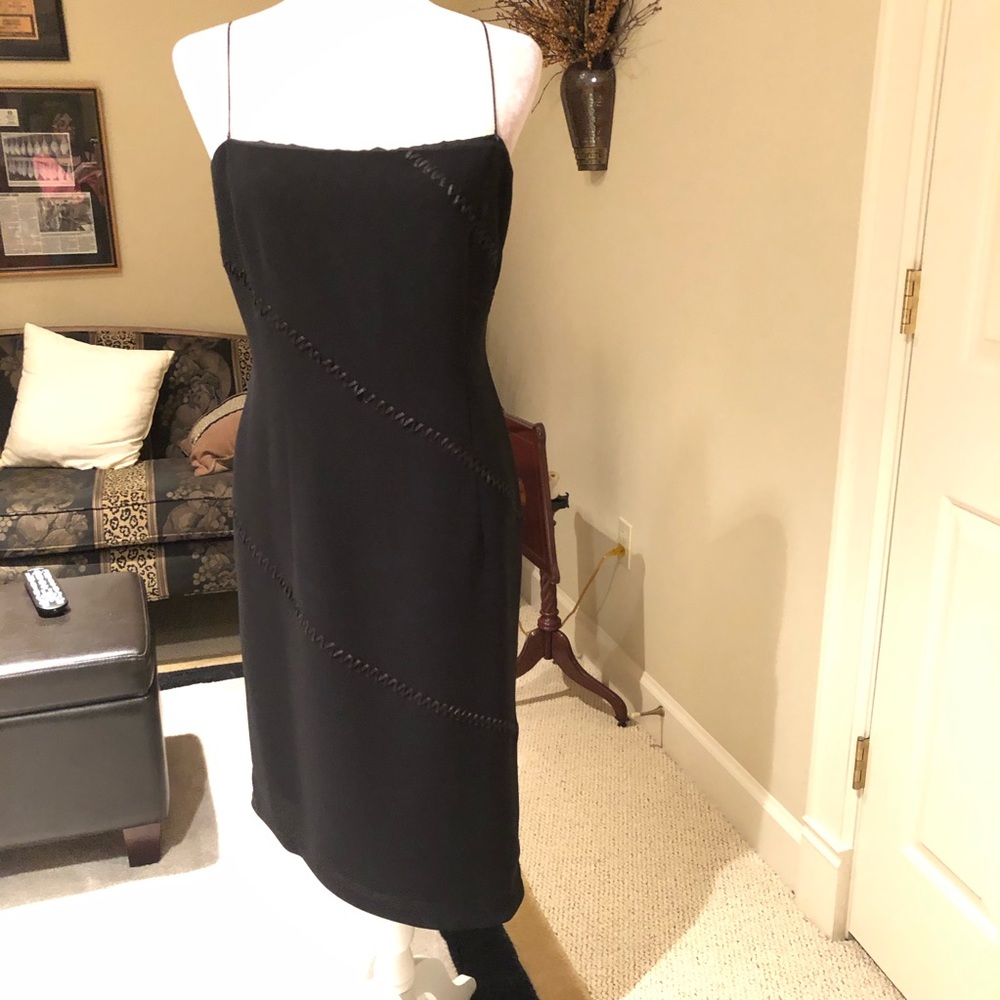 Black lined cocktail dress.
